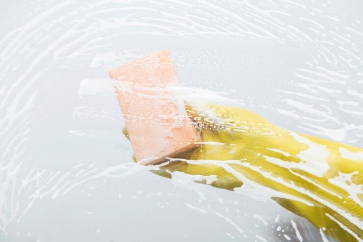 window cleaning with sponge