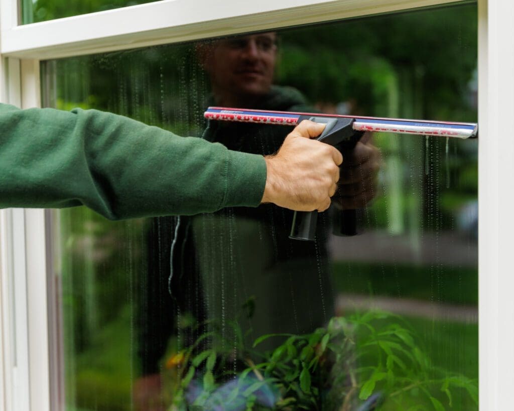 squeegee is used to clean a window