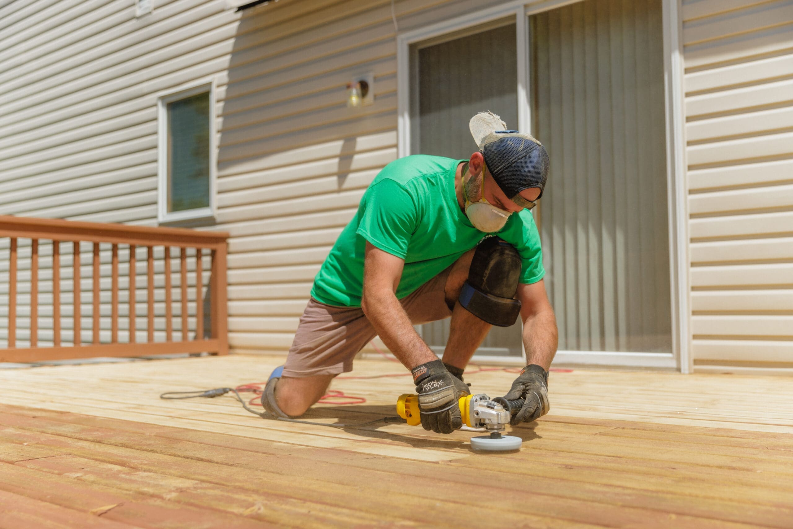 Wooden deck undergoing sanding for refinishing