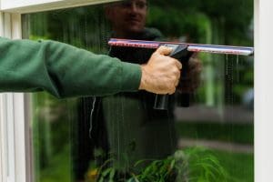 Hand cleaning window with squeegee